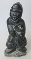 Speckstein 
Figur, Kanada, 
20. 
Jahrhundert. 
Der Mann mit 
Fisch. 
Unterzeichnet. 
665. H:. 15.5 
cm. ...