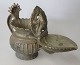 Ganesha 
Öllampe, 
Indien, 19. 
Jahrhundert. 
Cire perdue. 
Mit dem 
brennenden Topf 
und Container. 
...
