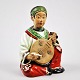 Spiele Nicke 
Puppe China. 
19. 
Jahrhundert. 
Glasierte 
Keramik. 
ûberglazur 
Dekoration in 
grün, ...