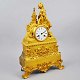 Französischer 
vergoldeter 
Kamin Uhr, ca. 
1810 - 1830. 
Mit Blattwerk 
verziert. 
Spitzenfigur in 
...