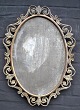 Spiegel, 19. 
Jh. Rahmen aus 
Bronze und 
bronziertem 
Eisen. Oval. 
H.: 62 cm. B.: 
45 cm.
NB: ...
