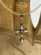 Vintage 
Silberkreuz mit 
transparenter 
"Kette" aus 
Naturkautschuk 
und 
Silberschloss. 
Das Kreuz ...