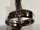 Ring aus 
14-karätigem 
Gold, 2 
zusammengelötete 
Ringe und 6 
Steindiamanten 
00,02 w/vs. 
Ringe der ...