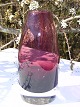 Finnische Glas 
Vase in einer 
schönen Farbe 
lila, Höhe 16 
cm. 
Unterzeichnet : 
1365 Riihiäën 
Lasi ...