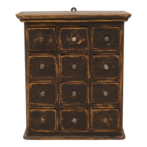 A black decorated wall-mounted cabient with 12 
drawers. Denmark circa 1860-80. H: 61cm. W: 54cm. 
D: 29cm