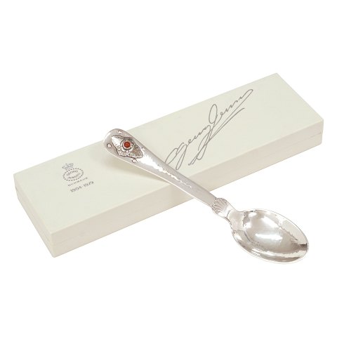 A sterlingsilver Georg Jensen 75 years anniversary 
spoon. L: 15cm