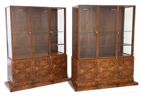 Pair of Danish Art Deco walnut showcases. Design 
by Bent Helweg-Møller, 1883-1956, Copenhagen and 
manufactured by C. B. Hansen circa 1925. H: 171cm. 
W base: 144cm. D: 55cm