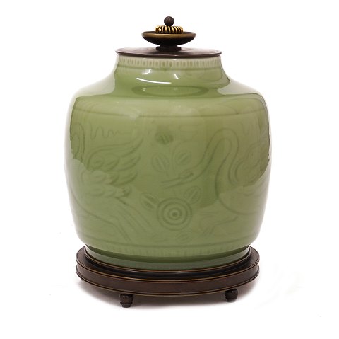 Celadon glazed lidded jar by Georg Thylstrup for 
Royal Copenhagen #2499. Bronze base and lid by 
Knud Andersen. Nice condition. H: 22cm