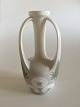 Royal 
Copenhagen Art 
Nouveau 3 
Hankevase med 
Mælkebøtte 
motiv No 
342/60B. Måler 
17,5cm og er i 
...