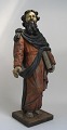 Holzskulptur, 
Moses mit Moses 
Buch unter dem 
Arm, 17. 
Jahrhundert. 
Schwarz, gelb 
und rot bemalt. 
...