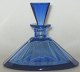 Perfume flacon 
in sea blue 
crystal, France 
o. 1920. 
conical; with 
conical stopper 
- presumably 
...