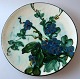 Pfannkuchen 
Teller, 
Keramik, c. 
1930. Kuhhorn 
Dekoration in 
gr&uuml;n, 
blau, schwarz, 
braun und ...