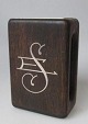 Match Holder, 
Silversmith F. 
Hingelberg, 
Aarhus, bog oak 
with inlays of 
silver. With 
monogram .: ...