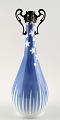 Royal 
Copenhagen Art 
Nouveau vase 
with mounting.
Measures 25 
cm.
1st. factory 
quality, in ...