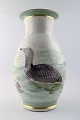 Royal 
Copenhagen 
large unique 
vase decorated 
with a diver,
hand painted.
Signed "TN 
43". ...