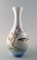 Royal 
Copenhagen Art 
Nouveau vase 
decorated with 
fish.
Measures 22 
cm. Marked.
1st. factory 
...