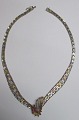 Halskette aus 
Sterlingsilber, 
teilweise 
vergoldet, 
Italien, 20. 
Jahrhundert. 
Mit sechs faux 
...