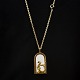 Georg Jensen 
'Sunshine & 
Night' Vedhæng 
Havfrue med 
spejl. 
Brass 
goldplated with 
14 kt ...