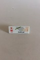 Bing & Grøndahl 
Dealer 
Advertising 
Sign "Orchid, 
Grey".
Measures 9,6cm 
x 3,7cm.