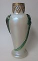 Vase, Kralik, 
1900, Bohemia. 
Light opal 
glass with 
green foliage. 
With brass 
fitting on 
edge. ...