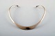 N.E. From 
necklace of 
sterling 
silver. Danish 
design 1970s.
Neckring 
diameter 13.5 
to 14.5 ...