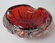 Swedish ashtray 
in clear glass 
with red 
overlay and air 
bubbles 1960s. 
Height .: 6,5 
cm. Dia .: ...