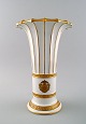 Royal 
Copenhagen vase 
with gold 
decoration. 
Trumpet-shaped.
Measures 26.5 
x 17 ...