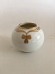 Royal 
Copenhagen Vase 
No 142/42A with 
Gold Motif . 6 
cm H (2 
23/64"). 1st 
Quality in good 
condition.