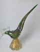 Fasan in grün, 
klares Glas, 
Murano, 
Italien, 1960. 
Mit eingelegtem 
Goldstaub. 
Höhe:. 29,5 cm. 
...