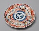 Japanische 
Imari 
Porzellanteller 
mit Pflanzen 
Ornamenten 
verziert. 19Jh. 
Durchmesser. 22 
cm.