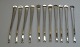 11 hummergafler 
i sølvplet, 
Danmark, 
stemplet: 
Eneret 40 B-J. 
L.: 16,8 cm. 