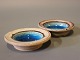 A set of 
ceramic salt 
jars with a 
dark blue glaze 
by Herman A. 
Kähler.
H - 2 cm and 
Dia - 7 cm.
