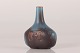 Gunnar Nylund 
(1904-1997)
Cute Bottle 
sharped Vase 
with blue and 
orangebrown 
haresfure ...