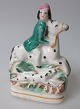 Staffordshire 
Figur, 
berittener 
Mann, um 1840. 
England. 
Polychrome 
gemalt. Höhe:. 
11 cm.
Mit ...