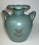 Arabien Vase, 
280, 20. 
Jahrhundert. 
Finnland. Grüne 
Glasur. 
Dekoriert auf 
der Seite mit 
Blumen. ...