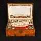 An almost complete  Toilet-Box with circa 50 pieces. France circa 1880. H: 16cm. 
W: 38cm. D: 26cm