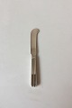 Georg Jensen 
Sterling Silver 
Bernadotte 
Butter Knife No 
046. Measures 
15 cm / 5 
29/32"