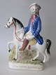 Staffordshire 
Figur des 
Räubers "Tom 
King", bemalte 
Fayence, ca. 
1840, England. 
25 x 17,5 ...