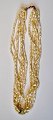 5-reihige Perlenkette, 20. Jh. Süßwasserperlen. Mit 14 Karat Goldschloss. Länge: 38 cm.