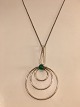 Silberanhänger 
mit grüner Jade
Durchmesser: 5 
cm. Höhe mit 
Axt: 9 cm.
Kettenlänge: 
45 ...
