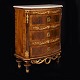 A Northgerman walnut veneered commode with marble top and gilt ornaments. Altona 
circa 1780. H: 97cm. W75cm. D: 40cm