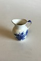 Royal 
Copenhagen Blue 
Flower Curved 
with Gold 
Creamer No. 
1538. Measures 
10 cm / 3 15/16 
in.