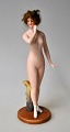 Deutsche 
Porzellanfigur, 
ca. 1900 -1910. 
Nackte Frau 
Kaltbemalte 
Bisquit-Figur 
mit geklebtem 
...