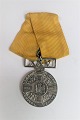 Dänemark. Ehrenzeichen der Feuerwehr von Kopenhagen. 25 Jahre Silber mit gelbem Band. ...