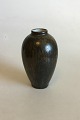 Royal 
Copenhagen Vase 
with brown 
glaze. Designed 
by Carl 
Frederik 
Ludvigsen . 
Marked 710 and 
2nd ...
