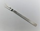 Georg Jensen. 
Bernadotte 
Silberbesteck. 
Sterling (925). 
Aufschnittgabel.
 Länge 15 cm.
