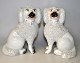 Paar 
Staffordshire 
Pudelhunde, ca. 
1840 England. 
Weiße Fayence 
mit Streusel 
und Farbe. H: 
19 ...
