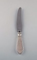 Georg Jensen 
"Continental" 
dinner knife in 
sterling silver 
and stainless 
steel. Dated 
1915-30. ...