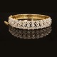 Armring aus 18kt Gold mit 13 Diamanten. Masse innen: 5,6x6cm