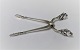 Georg Jensen. 
Silberbesteck. 
Sterling (925). 
König. 
Zuckerzange. 
Länge 9 cm.